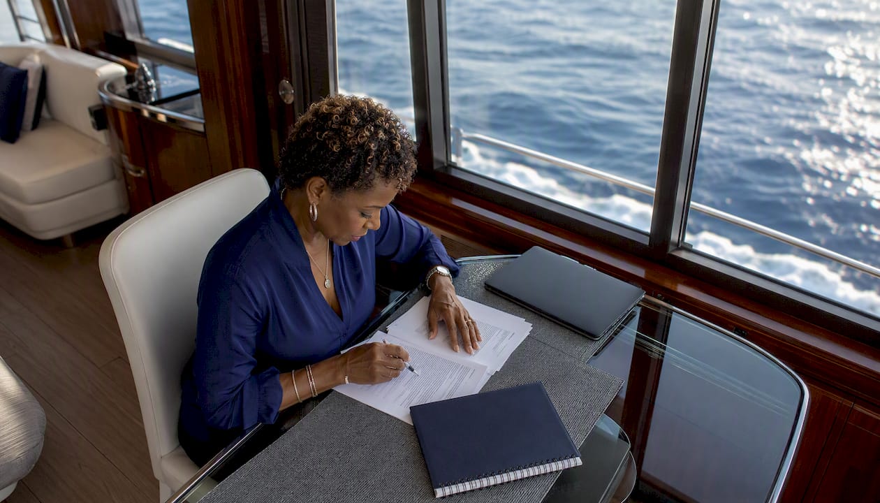Insurance professional reviewing yacht charter documents