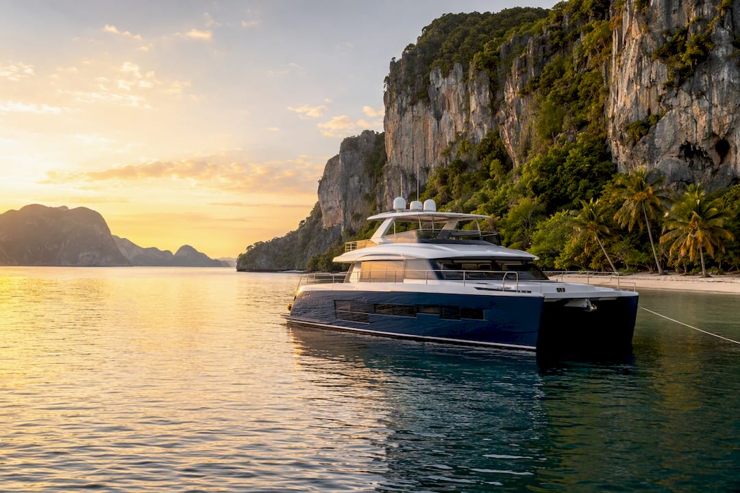 Luxury power catamaran anchored at island bay