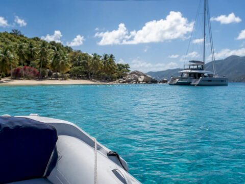 Luxury catamaran anchored near BVI coastline