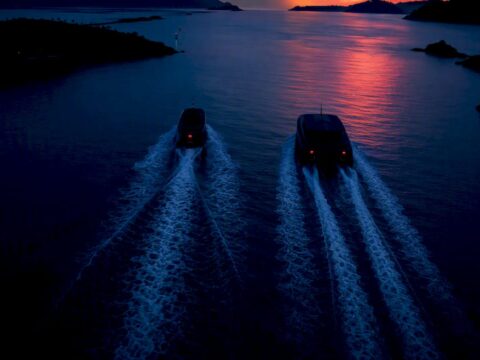 Anonymous yacht hulls crossing Caribbean water