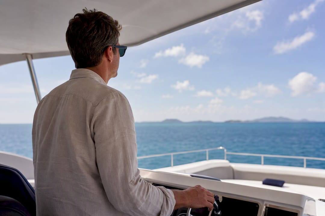 Guest viewing the horizon from flybridge helm