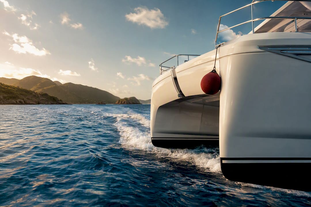 Power catamaran cruising through BVI waters
