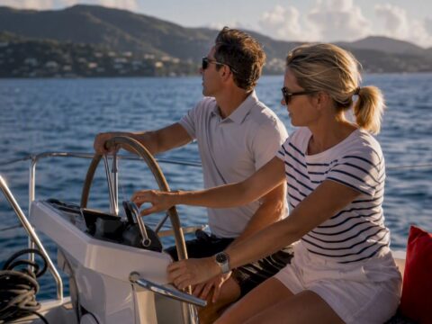 Couple sharing helm during BVI charter