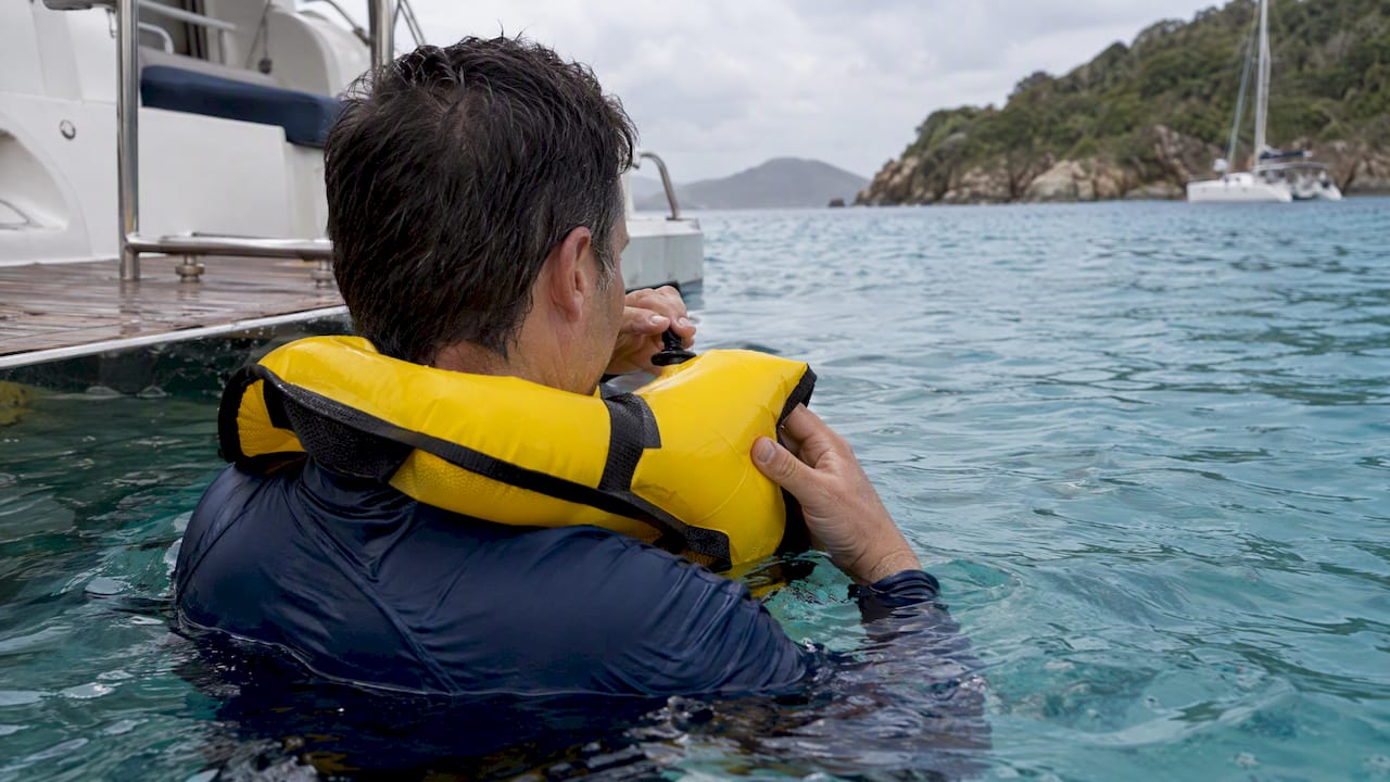 Guest testing an inflated snorkel vest