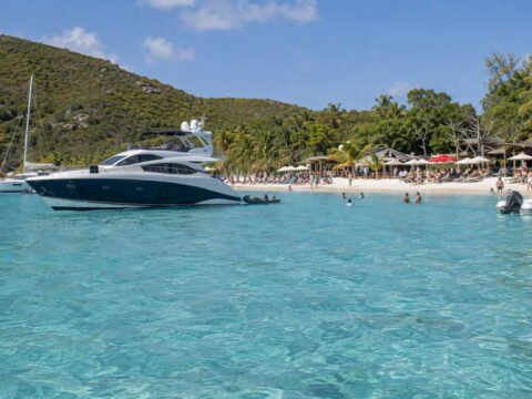 Yacht anchored offshore from White Bay beach bars