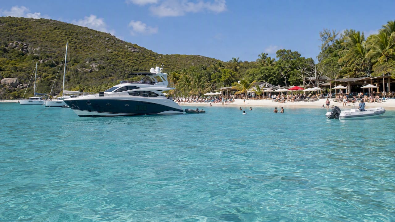 Yacht anchored offshore from White Bay beach bars