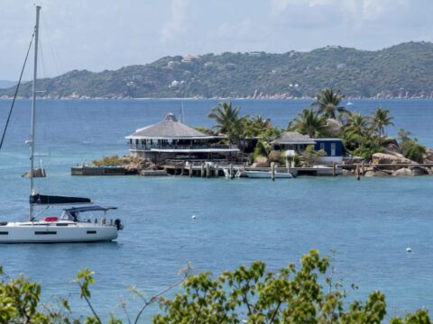 Saba Rock islet and yacht in North Sound