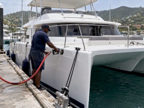 Power catamaran refueling at a Tortola dock