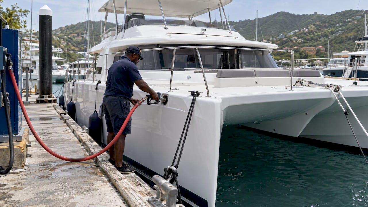 Power catamaran refueling at a Tortola dock