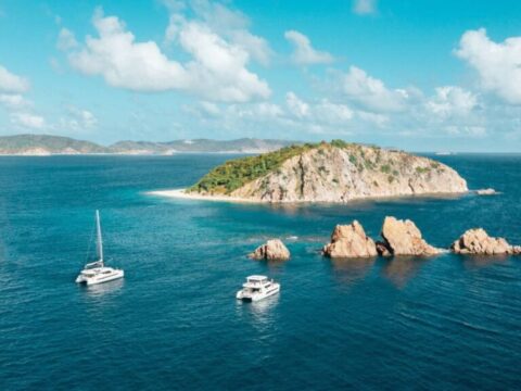 Power catamaran and sailing catamaran cruising in the British Virgin Islands