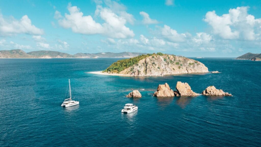 Power catamaran and sailing catamaran cruising in the British Virgin Islands