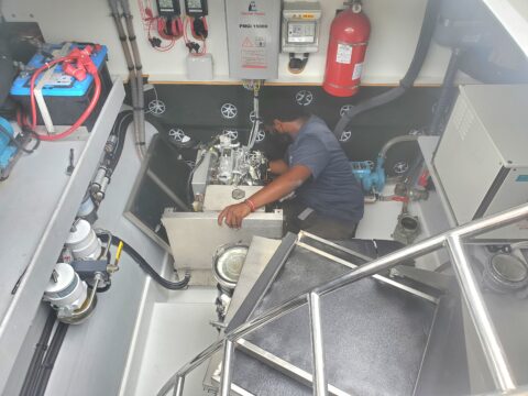 Virgin Charter Yachts maintenance team providing technical support for bareboat power catamarans in the British Virgin Islands.
