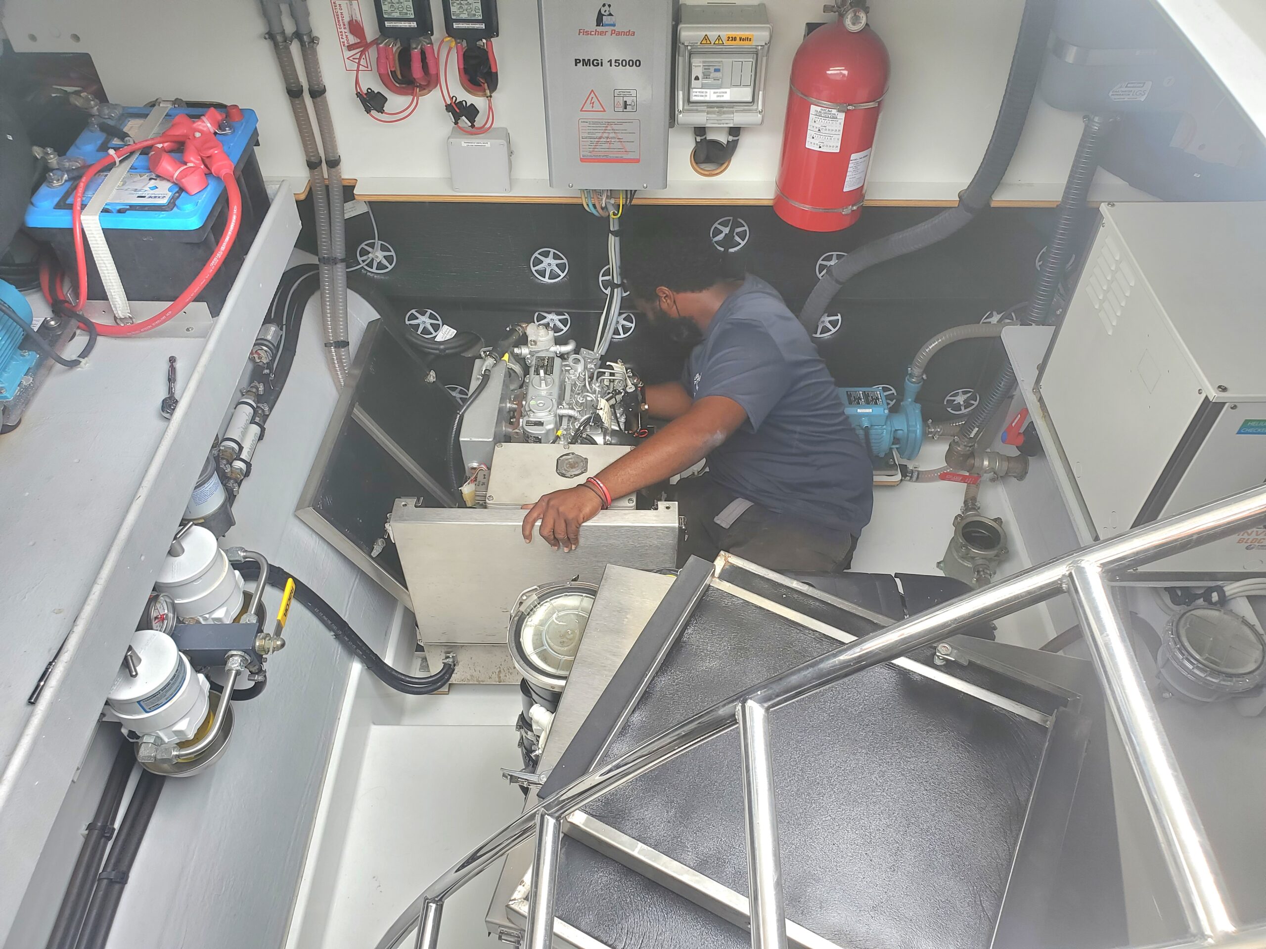 Virgin Charter Yachts maintenance team providing technical support for bareboat power catamarans in the British Virgin Islands.